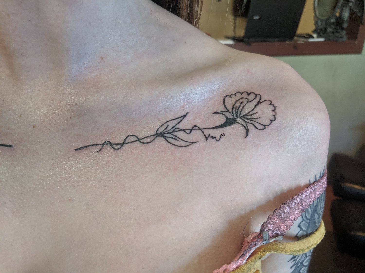 Matching fine line flower along the other collarbone, a mirrored pair, Parksville BC