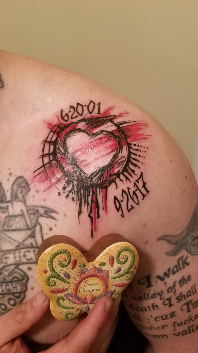 Sketch-style red and black memorial heart with dates, shoulder tattoo, Parksville BC