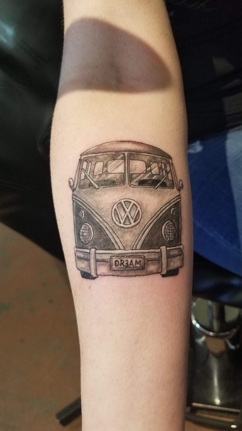Black and grey Volkswagen bus tattoo with a DREAM plate, forearm, Parksville BC